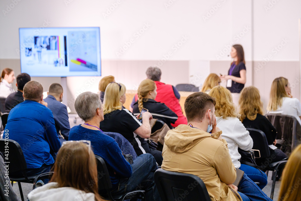 Business speaker doing presentation to audience