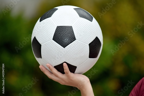 A Hand Holding Soccer Ball © dtiberio