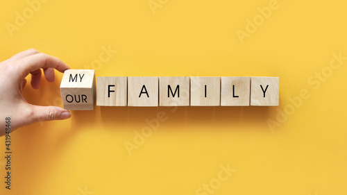 Wooden cubes with the inscription: my, our family. The choice of a person to stay in the family or leave
 photo