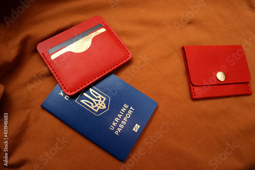 Leather wallets and passport on a brown background