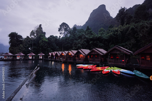 Bungalows on Cheow Lan Lake in Khao Sok National Park at rain time, Surat Thani Province, Thailand.