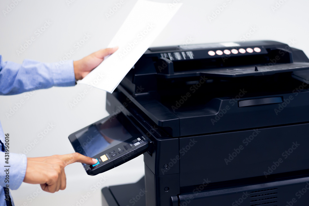 Bussiness man Hand press button on panel of printer, printer scanner laser in office copy machine supplies start concept. Bussiness man Hand press button on panel of printer, printer scanner laser in office copy machine supplies start concept.