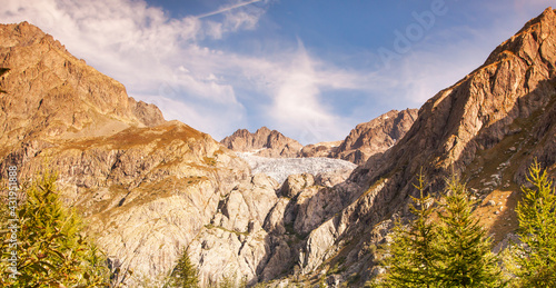 Beautiful sunny mountain landscape with blue sky. Web banner.