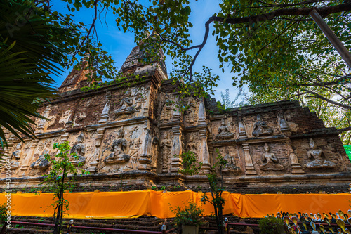 Wat Chet Yot or Wat Photharam Maha Wihan, seven pagoda temple It is a major tourist attraction in Chiang Mai, Thailand.with evening,Temple in Chiang Mai. photo