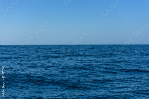 Blue sea on sky background