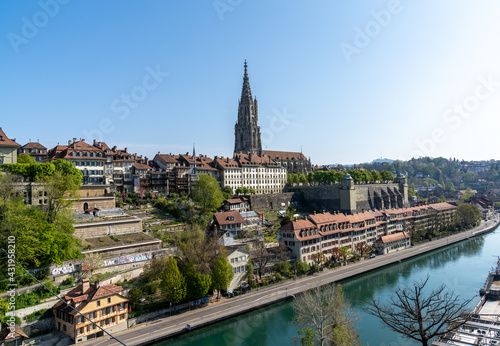 a view of the cathedral in Bern and the old town along the Aare River © makasana photo