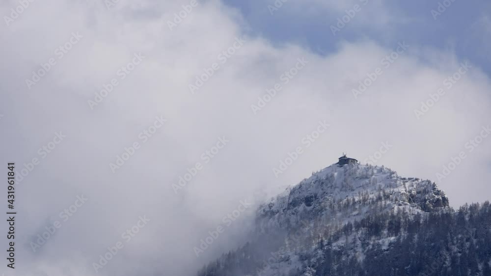 time lapse of fast moving clouds around the Kehlsteinhouse, near Berchtesgaden, Bavaria, Germany in winter time lapse of fast moving clouds around the Kehlsteinhouse, near Berchtesgaden, Bavaria, Germany in winter