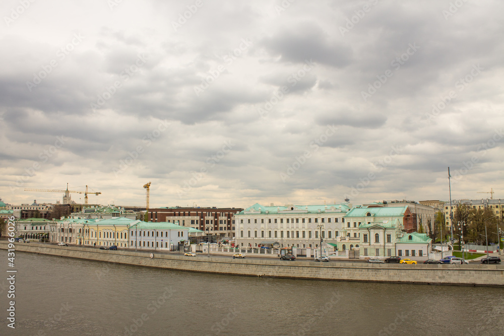 panoramic view of the Moskva River and the Sofia embankment with historical buildings against a cloudy sky and space to copy in Moscow Russia