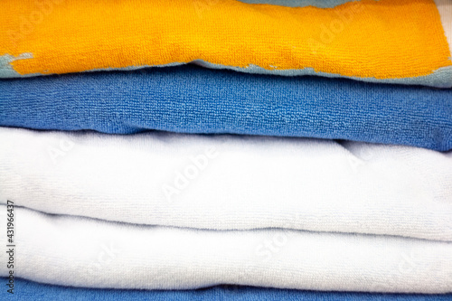 A stack of velvet towels. Image on the theme of knitwear, fabrics.