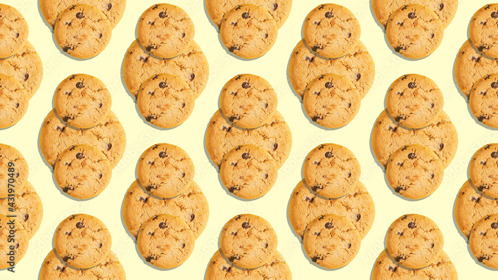 Seamless pattern of whole cookies with pieces of chocolate on a beige background pop art Seamless pattern of whole cookies with pieces of chocolate on a beige background pop art