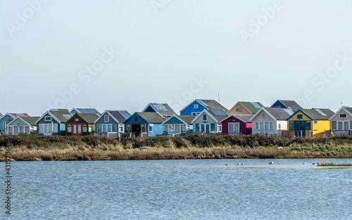 bright colourful beach huts by the sea