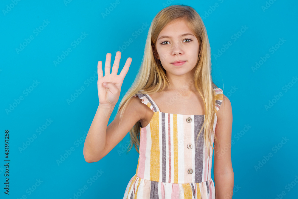 beautiful Caucasian little girl wearing stripped dress over blue background showing and pointing up with fingers number four while smiling confident and happy. beautiful Caucasian little girl wearing stripped dress over blue background showing and pointing up with fingers number four while smiling confident and happy.