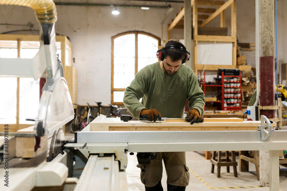 Craftsman working at workbench in industry Craftsman working at workbench in industry