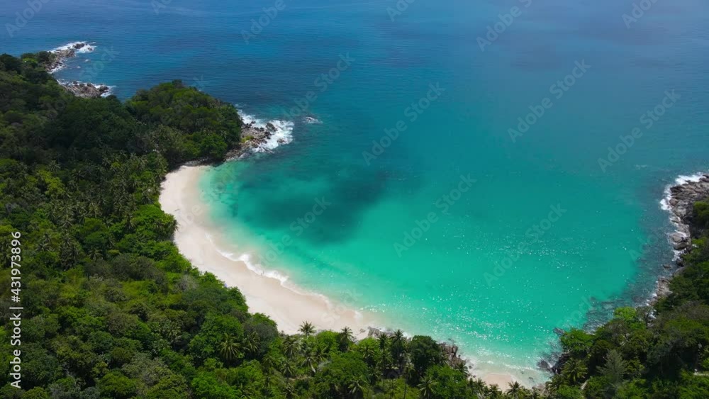Professional Video. Aerial view shot. Drone camera over white beach sand and sew water clear. Nature video view of beautiful tropical beach and yacht at sea. Freedom beach. At Phuket, Thailand. Professional Video. Aerial view shot. Drone camera over white beach sand and sew water clear. Nature video view of beautiful tropical beach and yacht at sea. Freedom beach. At Phuket, Thailand.