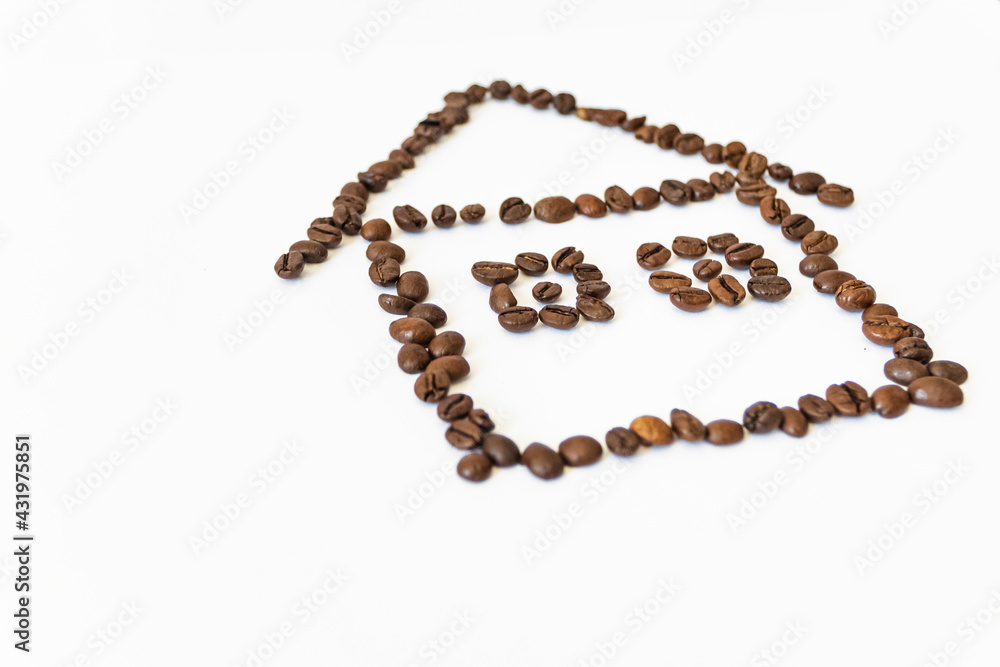 coffee beans on a white background in the shape of a house. homemade coffee. coffee beans on a white background in the shape of a house. homemade coffee.