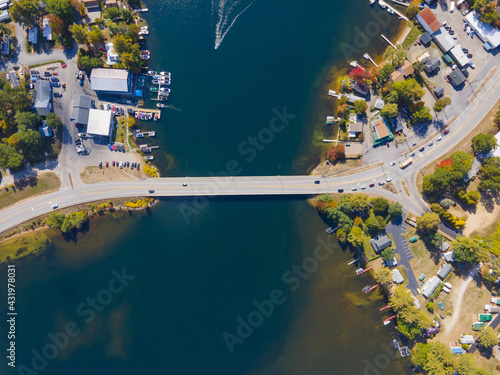 Top view of Lake Winnisquam and US Route 3 bridge between town of Belmont and Sanbornton in New Hampshire NH, USA. 