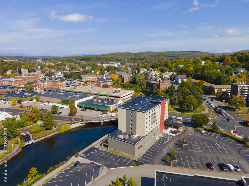 Laconia city center and Opechee Bay of Lake Winnipesaukee aerial view with fall foliage in downtown Laconia, New Hampshire NH, USA. Laconia city center and Opechee Bay of Lake Winnipesaukee aerial view with fall foliage in downtown Laconia, New Hampshire NH, USA.