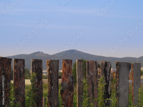 Wooden fence and mountains in the distance