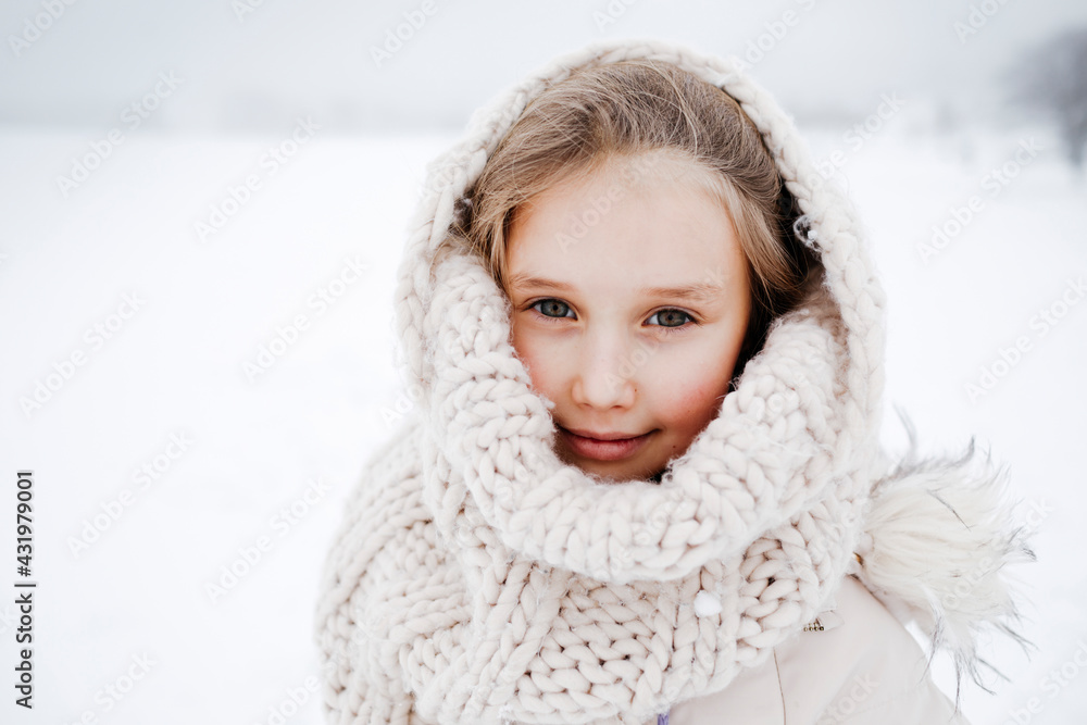Small girl covered with knitted scarf during winter Small girl covered with knitted scarf during winter