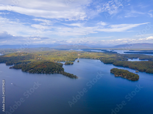 Lake Winnipesaukee and village of Weirs Beach aerial view with fall foliage in City of Laconia, New Hampshire NH, USA. 