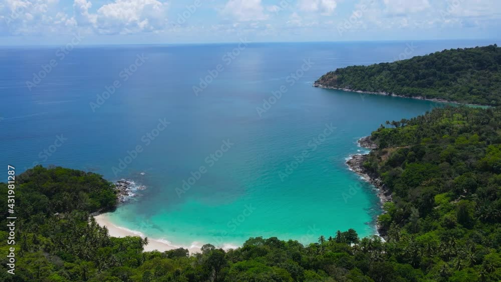 Professional Video. Aerial view shot. Drone camera over white beach sand and sew water clear. Nature video view of beautiful tropical beach and yacht at sea. Freedom beach. At Phuket, Thailand. Professional Video. Aerial view shot. Drone camera over white beach sand and sew water clear. Nature video view of beautiful tropical beach and yacht at sea. Freedom beach. At Phuket, Thailand.