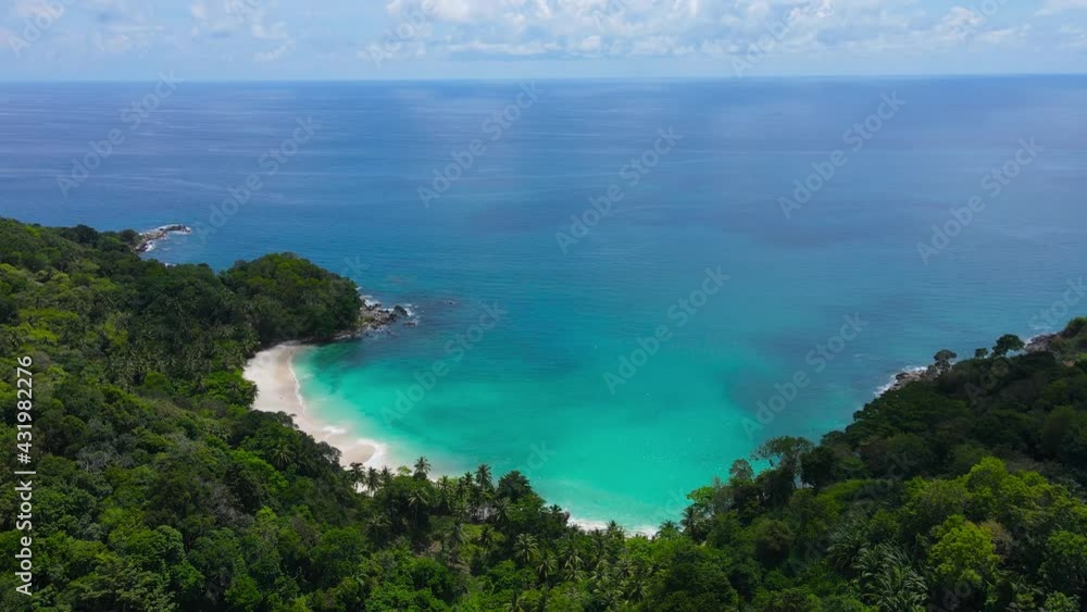 Professional Video. Aerial view shot. Drone camera over white beach sand and sew water clear. Nature video view of beautiful tropical beach and yacht at sea. Freedom beach. At Phuket, Thailand. Professional Video. Aerial view shot. Drone camera over white beach sand and sew water clear. Nature video view of beautiful tropical beach and yacht at sea. Freedom beach. At Phuket, Thailand.