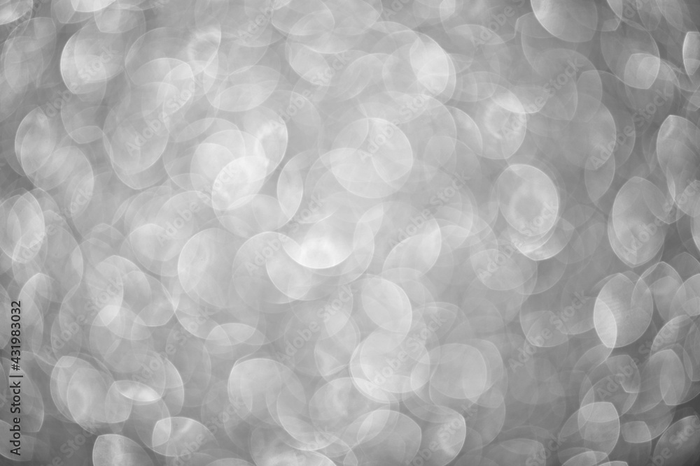 Abstract festive elegant gray background of blurred with bokeh lights and stars texture