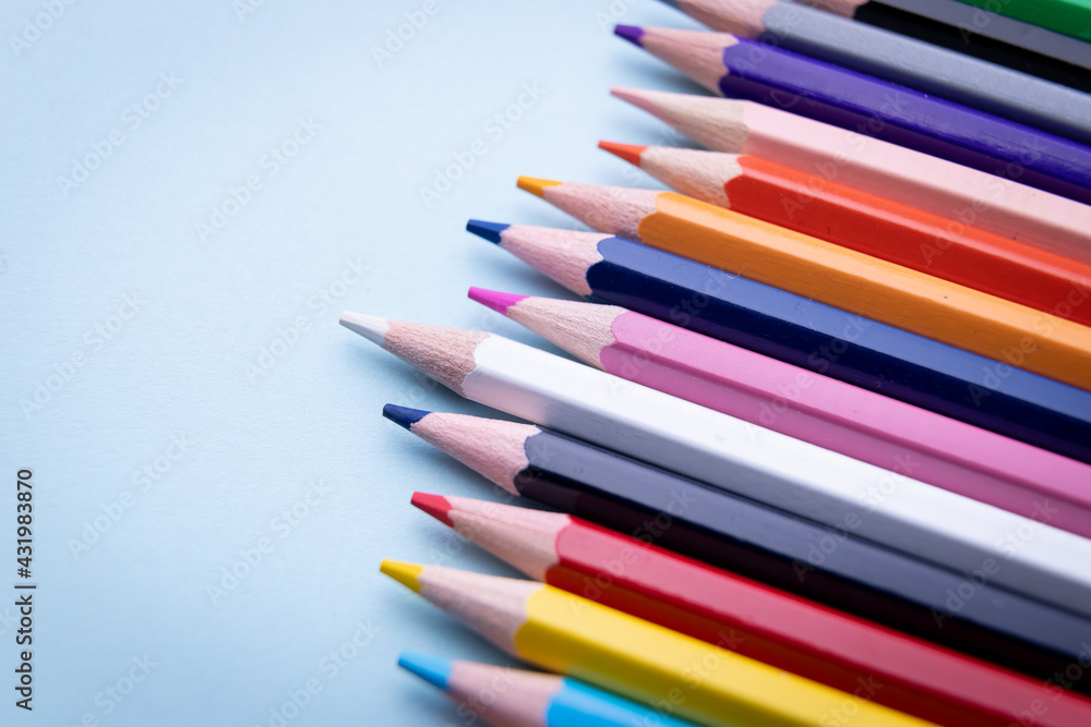 Colorful pencil set on blue background Colorful pencil set on blue background