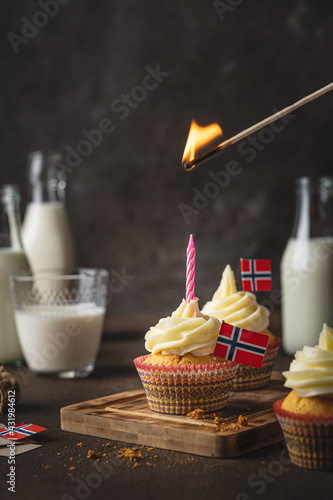 A photo of muffins with Norwegian flag to Norwegian Independence day or for birthday