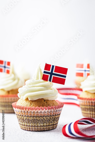 A photo of muffins with Norwegian flag to Norwegian Independence day or for birthday