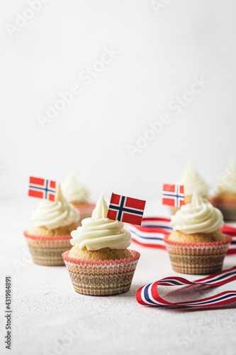 A photo of muffins with Norwegian flag to Norwegian Independence day or for birthday