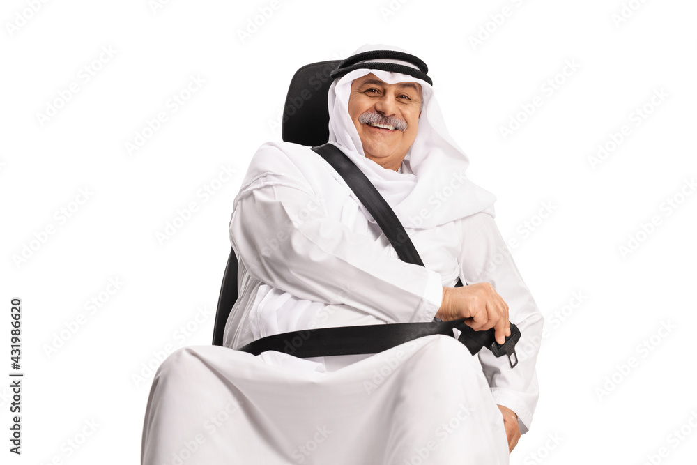Smiling mature arab man putting on a seat belt Smiling mature arab man putting on a seat belt