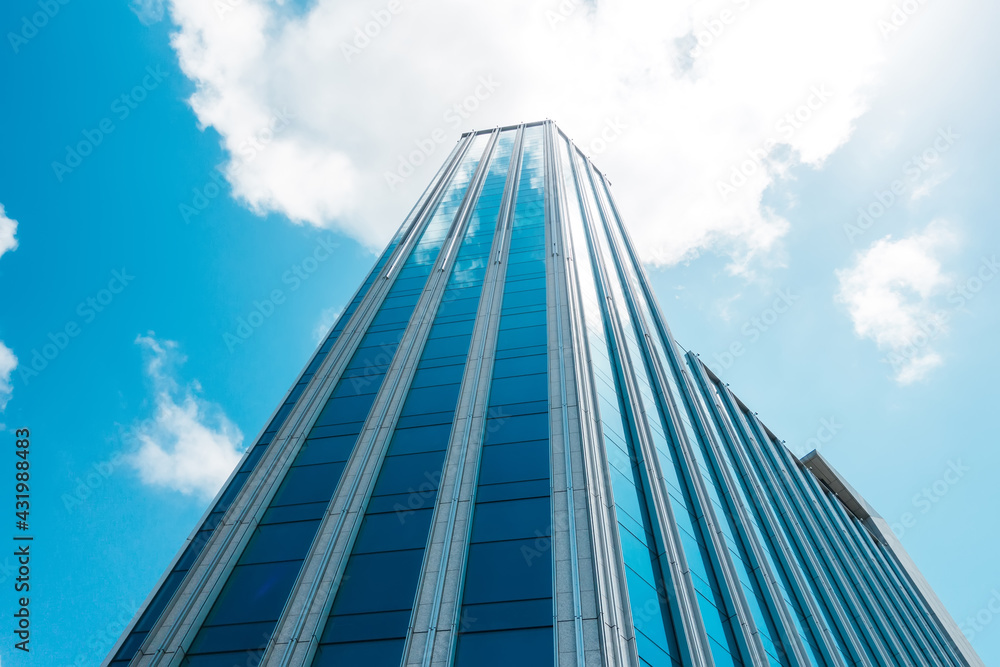 Obraz premium underside panoramic and perspective view to steel blue glass high rise building skyscrapers, business concept of successful industrial architecture