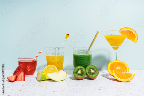 Healthy fruit juices on terrazzo marble against wall at home photo