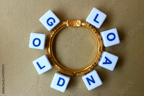 Gold loan concept depiction through jewelry, plastic blocks and written words
