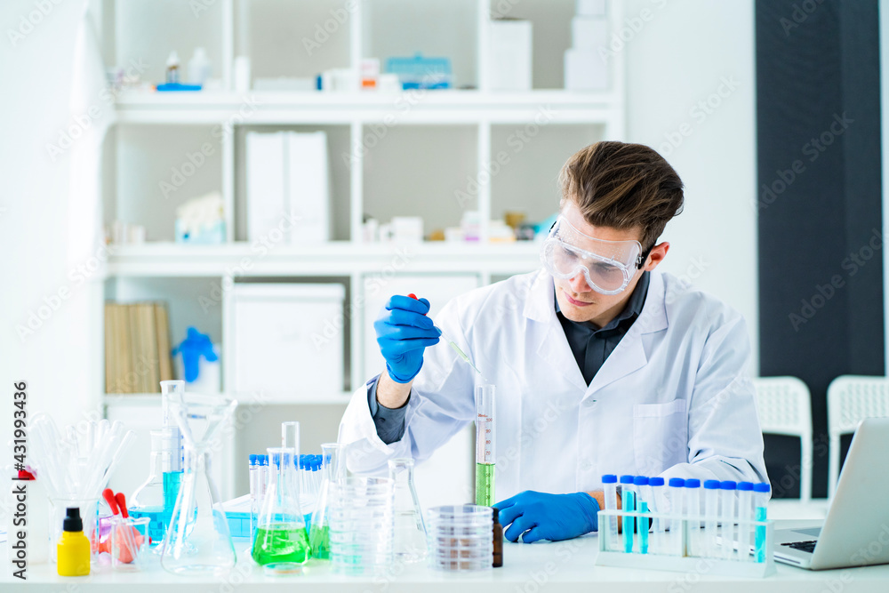 Male scientist working in laboratory Male scientist working in laboratory