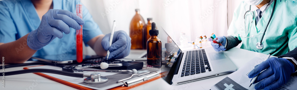 doctor or scientist with a stethoscope holding COVID-19 vaccine, Healthcare And Medical concept, vaccine Concept fight against virus covid-19 corona virus doctor or scientist with a stethoscope holding COVID-19 vaccine, Healthcare And Medical concept, vaccine Concept fight against virus covid-19 corona virus