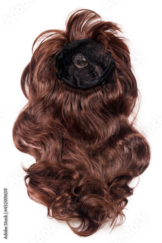 Female chocolate brown wig isolated on white background. Golden brown human hair weaves, extensions and wigs. Woman beauty concept.
