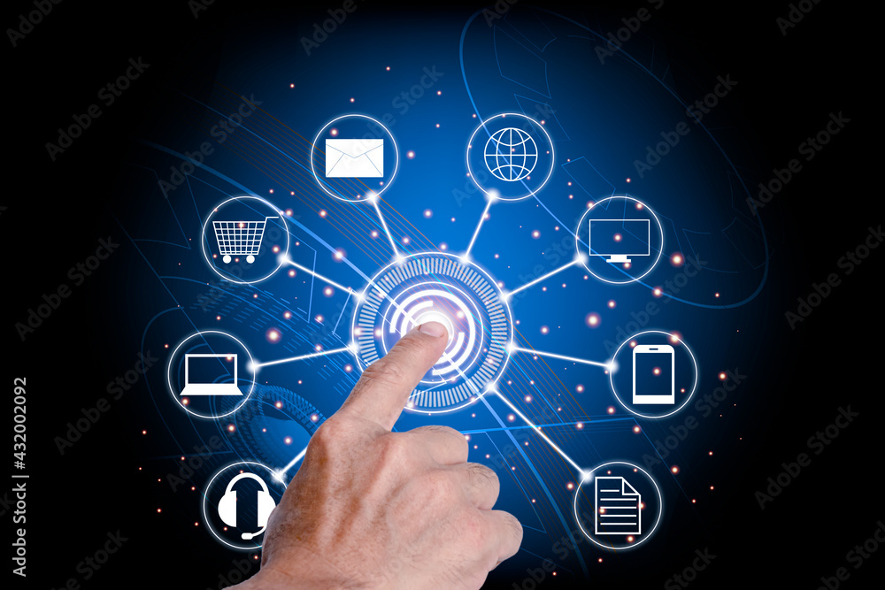 The man's hand pointing to press the center of the hitech circle symbol. The meaning of online communication, shopping, messages, e-mail via the Internet network. The man's hand pointing to press the center of the hitech circle symbol. The meaning of online communication, shopping, messages, e-mail via the Internet network.