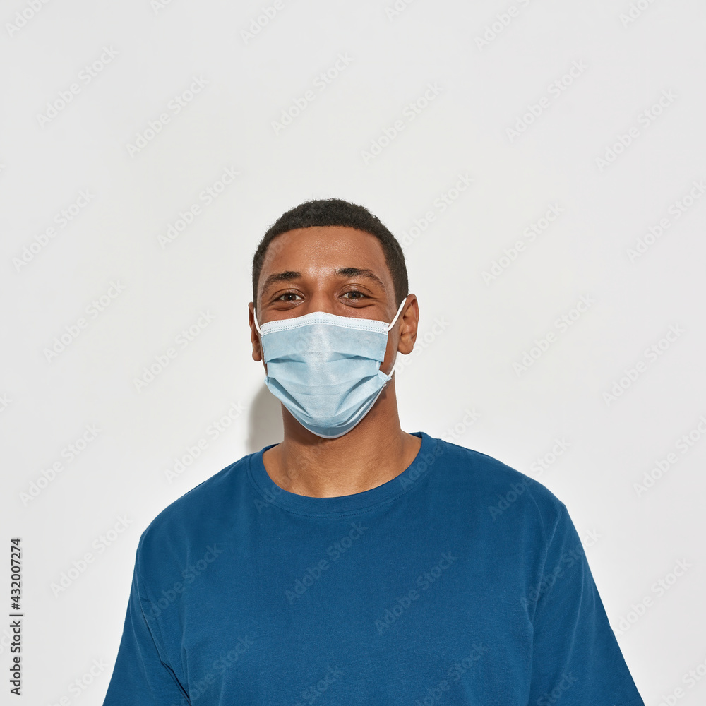 Portrait of happy young african american man in mask Portrait of happy young african american man in mask