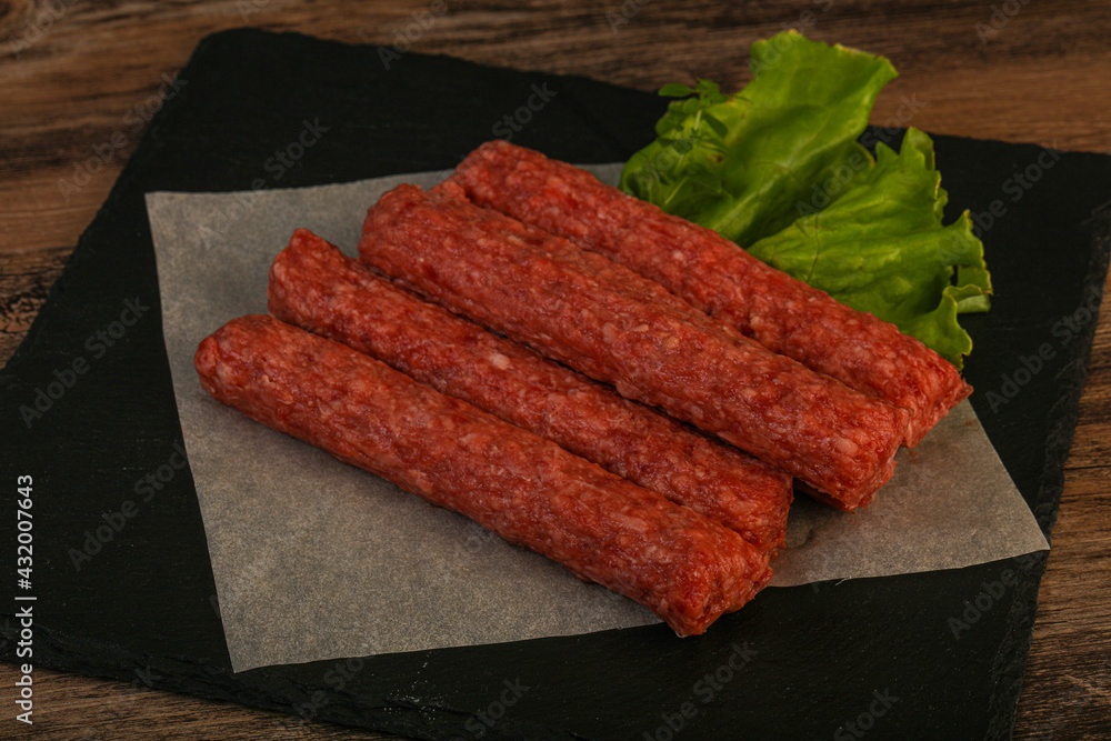 Raw beef sausages with spices