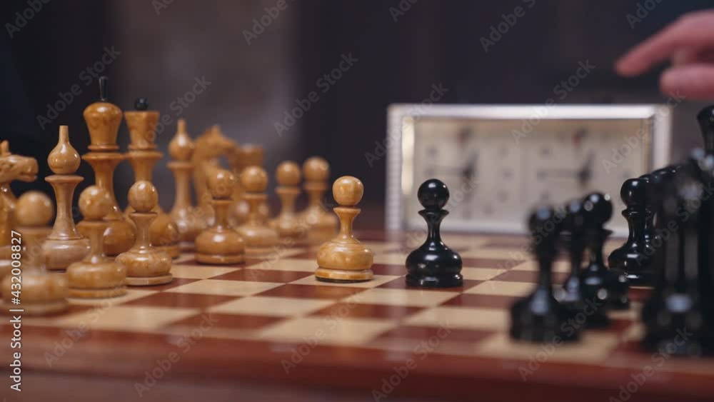 Two chess players man and woman play chess. Debut Accepted Queen's Gambit, King's Gambit, Philidor's Defense. Cinematic filming of a chess game. Antique chess board. This shot can be used for films Two chess players man and woman play chess. Debut Accepted Queen's Gambit, King's Gambit, Philidor's Defense. Cinematic filming of a chess game. Antique chess board. This shot can be used for films