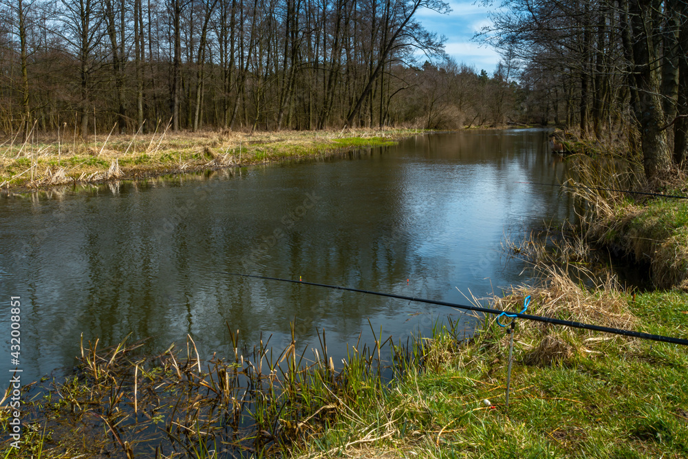 Obraz premium Fishing on the small river Grabia in the center of Poland. 