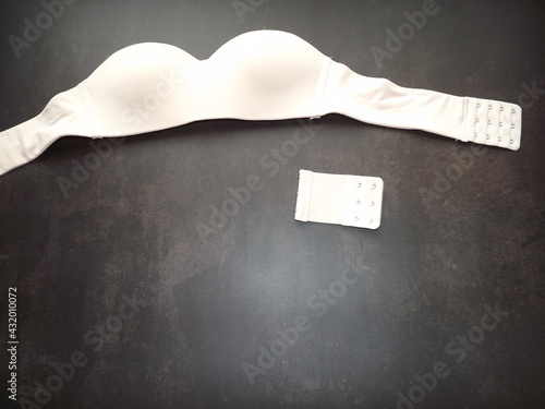 bra with extension cord for larger size close-up. close-up beige bra size correction. High quality photo