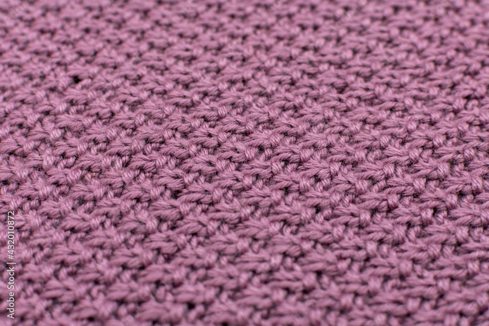 Knitted fabric pearl woolen background, close-up. The structure of the fabric with a natural texture. Fabric background. Knitted woolen background. Close-up. Knitted fabric pearl woolen background, close-up. The structure of the fabric with a natural texture. Fabric background. Knitted woolen background. Close-up.