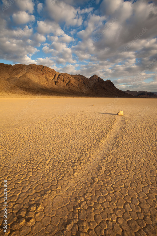 © Tandem Stock - A moving rock in sunrise light at Death Valley's Racetrack Playa.