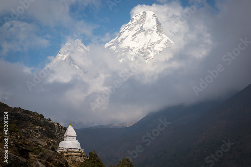 A Buddhist Stupa in front of Ama Dablam in Nepal. photo