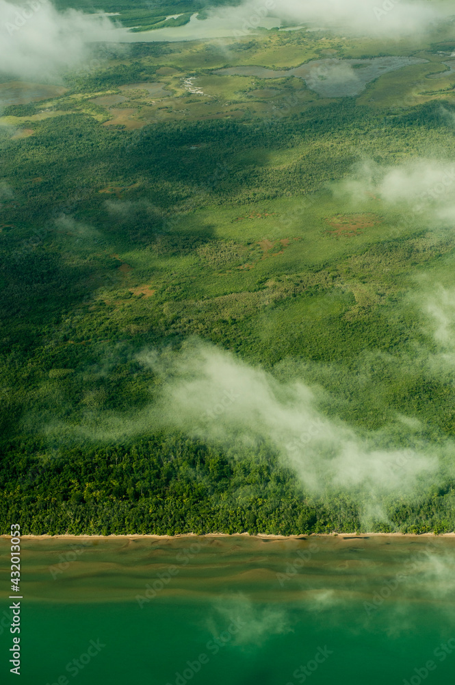 Aerial view of the jungles, beaches and farmland along the east coat of Belize.