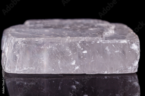 Fotografie Macro mineral stone Iceland spar on black background