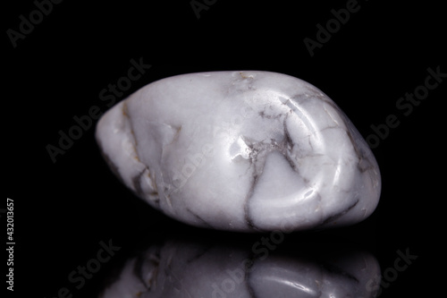 Macro mineral stone Magnesite on black background